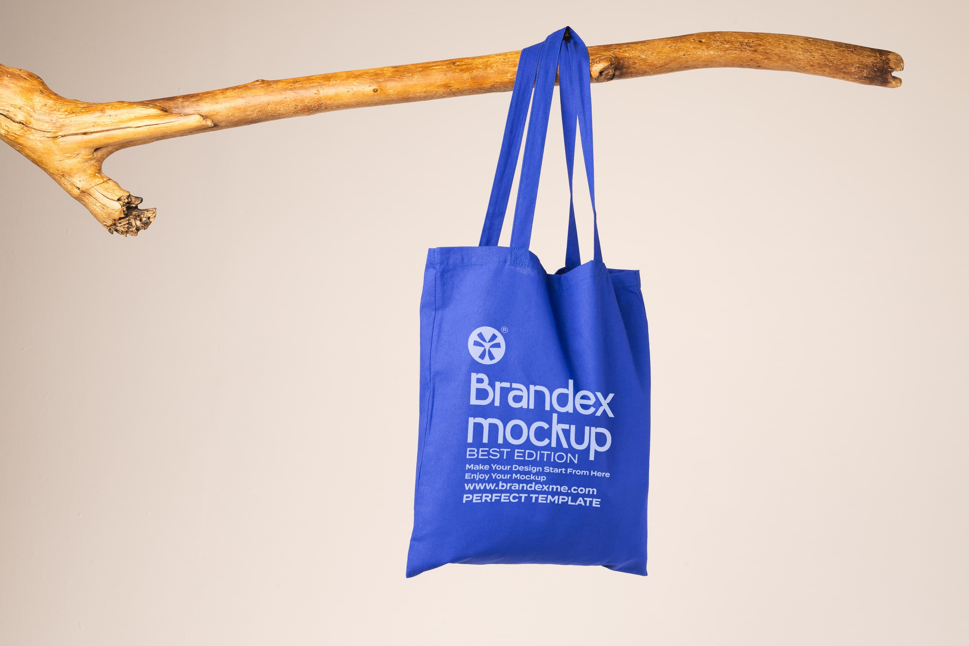 Brandex Mockup – Blue Canvas Tote Bag Hanging on Wooden Rod