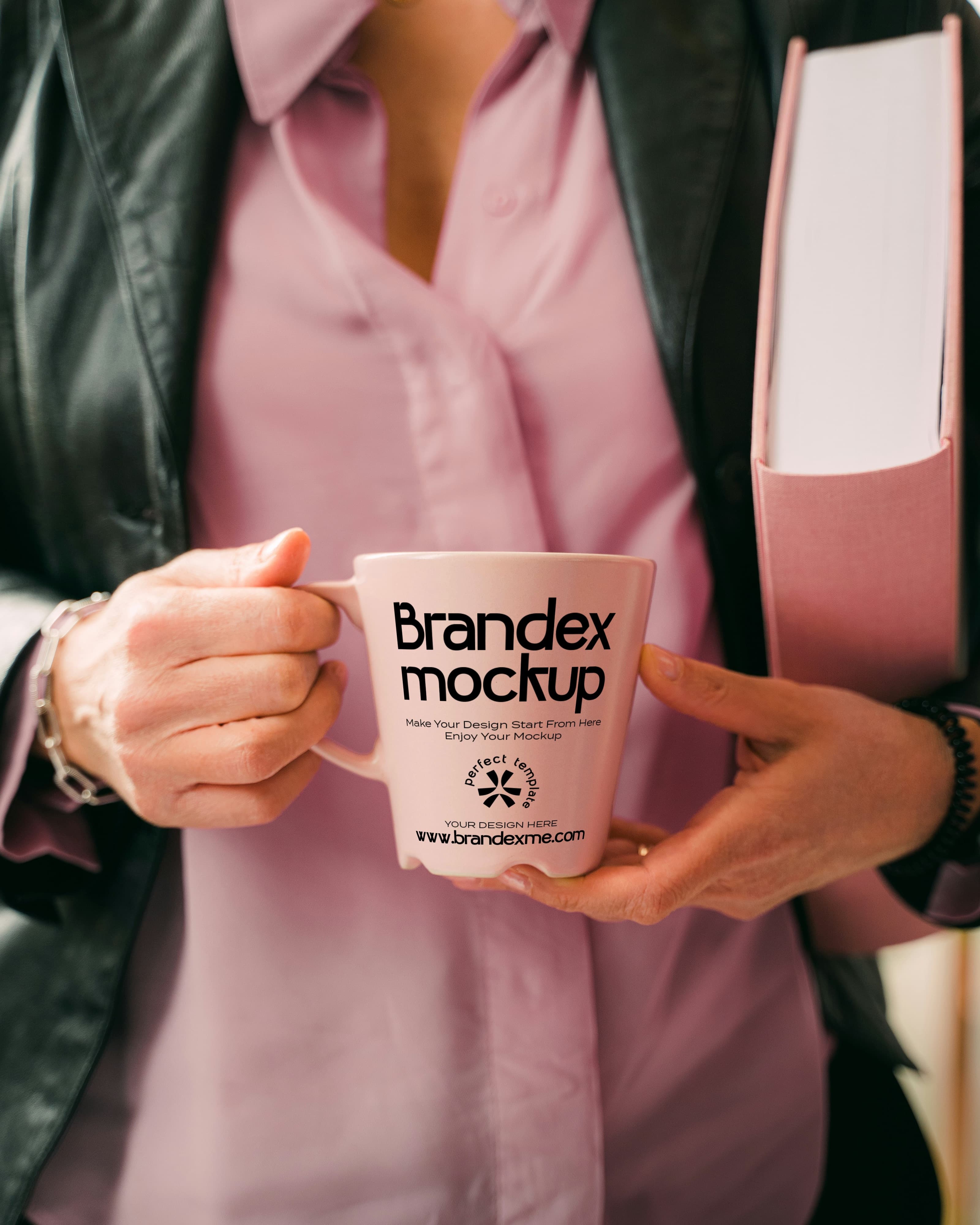 Pink coffee mug in hands mockup