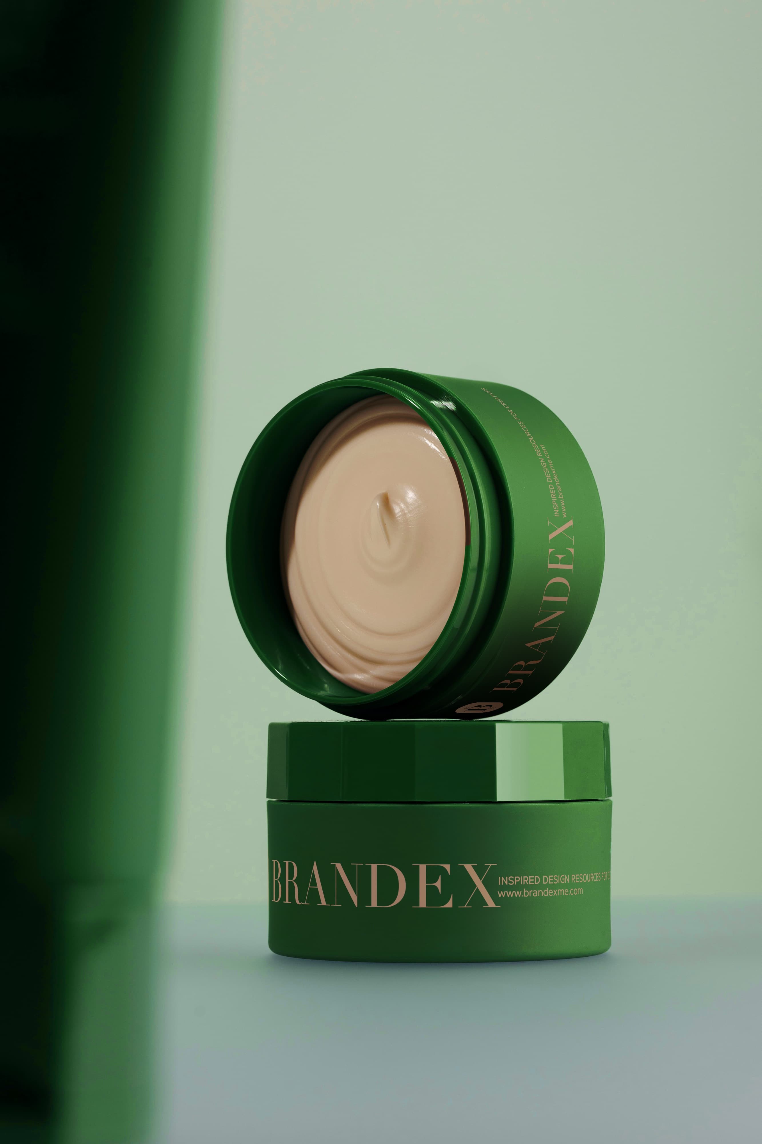Green cosmetic cream jar mockup