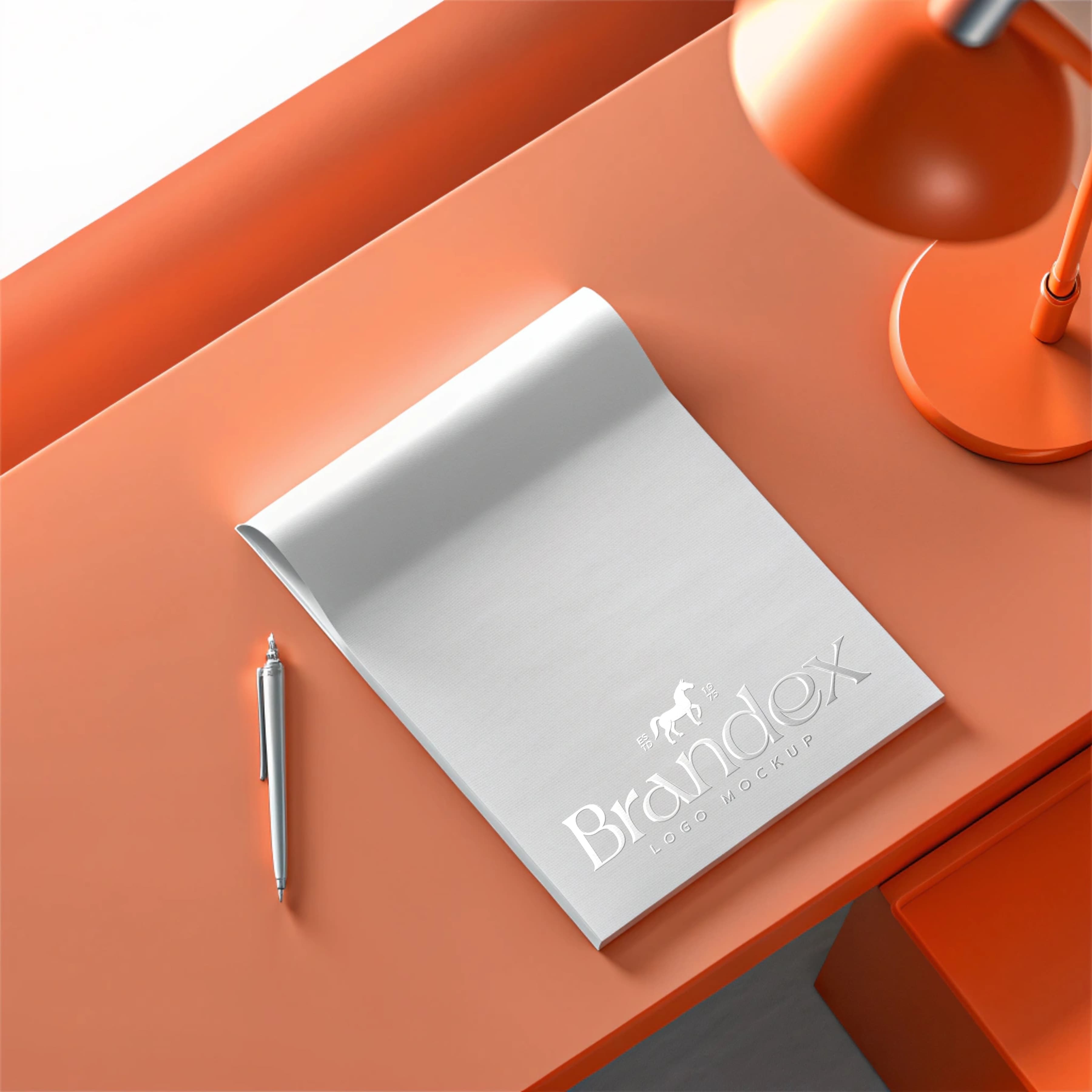 Embossed notepad on orange desk mockup