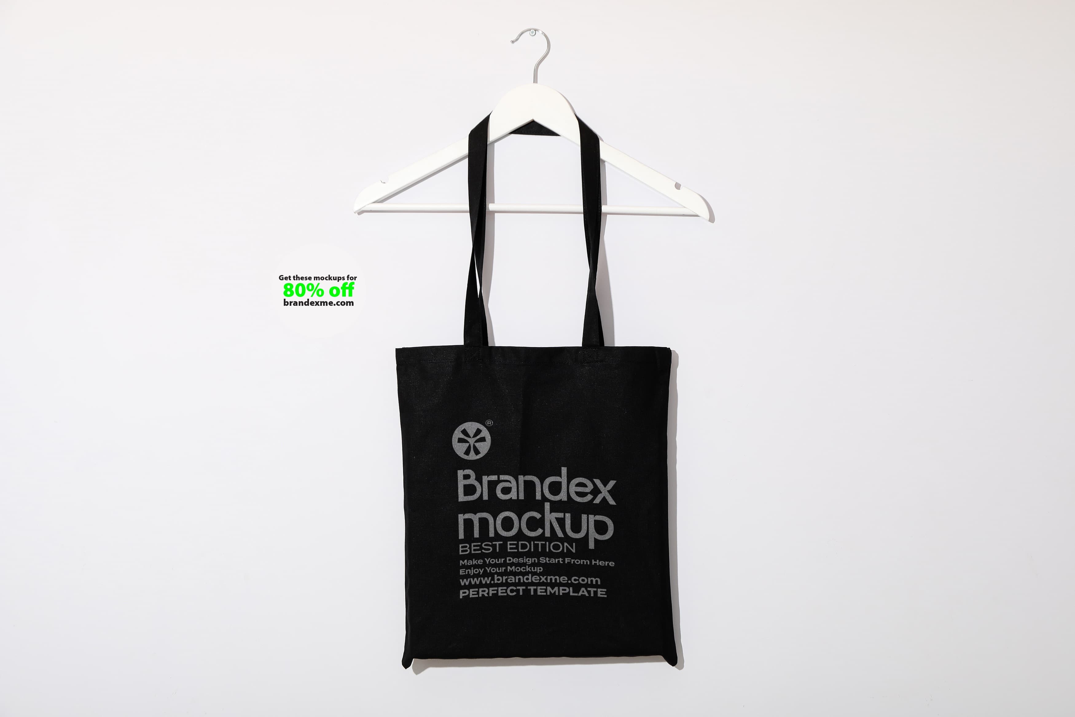 Black tote bag on hanger mockup