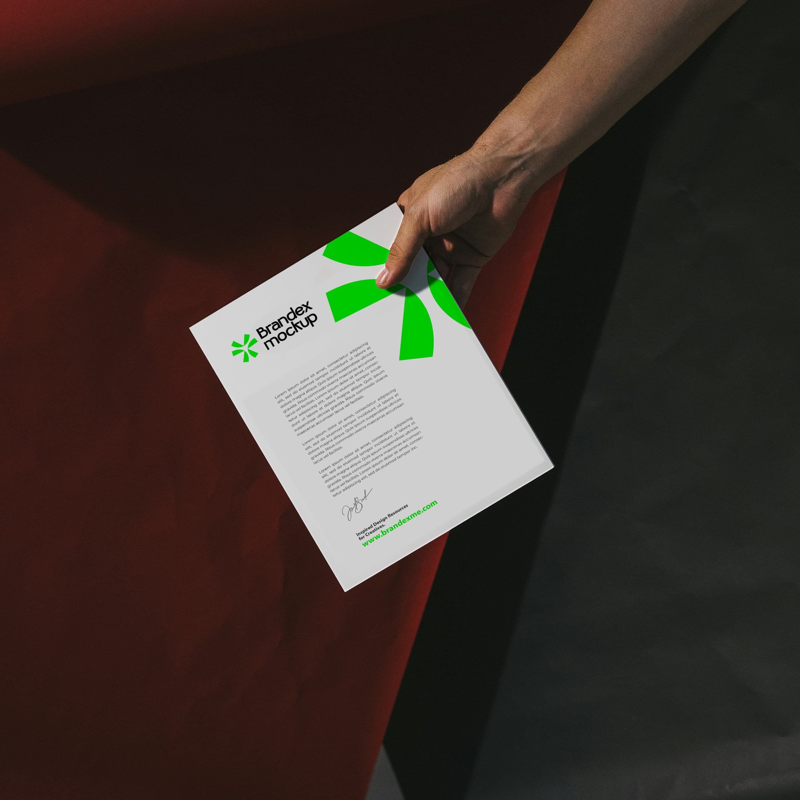 Handheld letterhead mockup with green accents