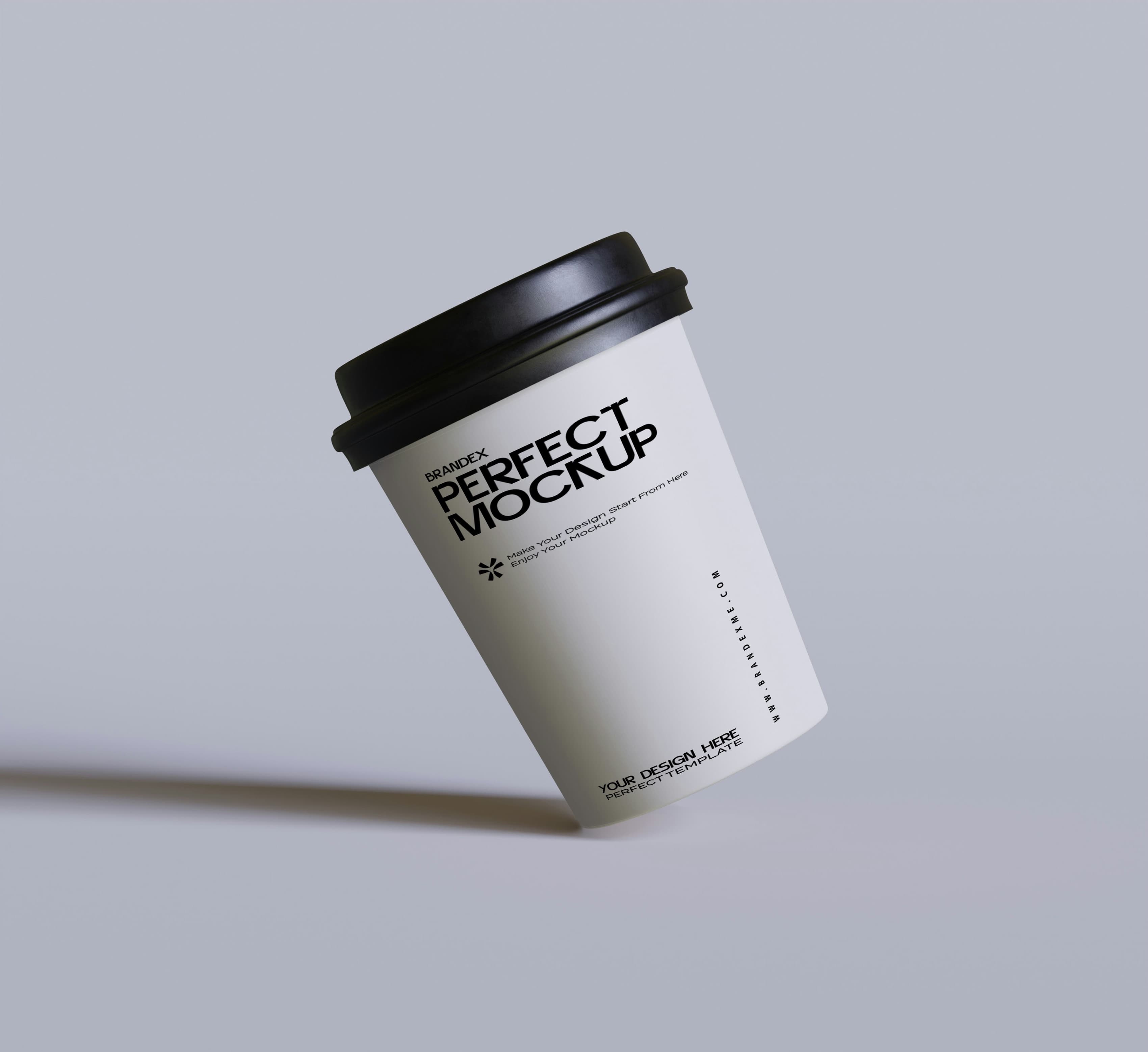 Tilted paper coffee cup mockup