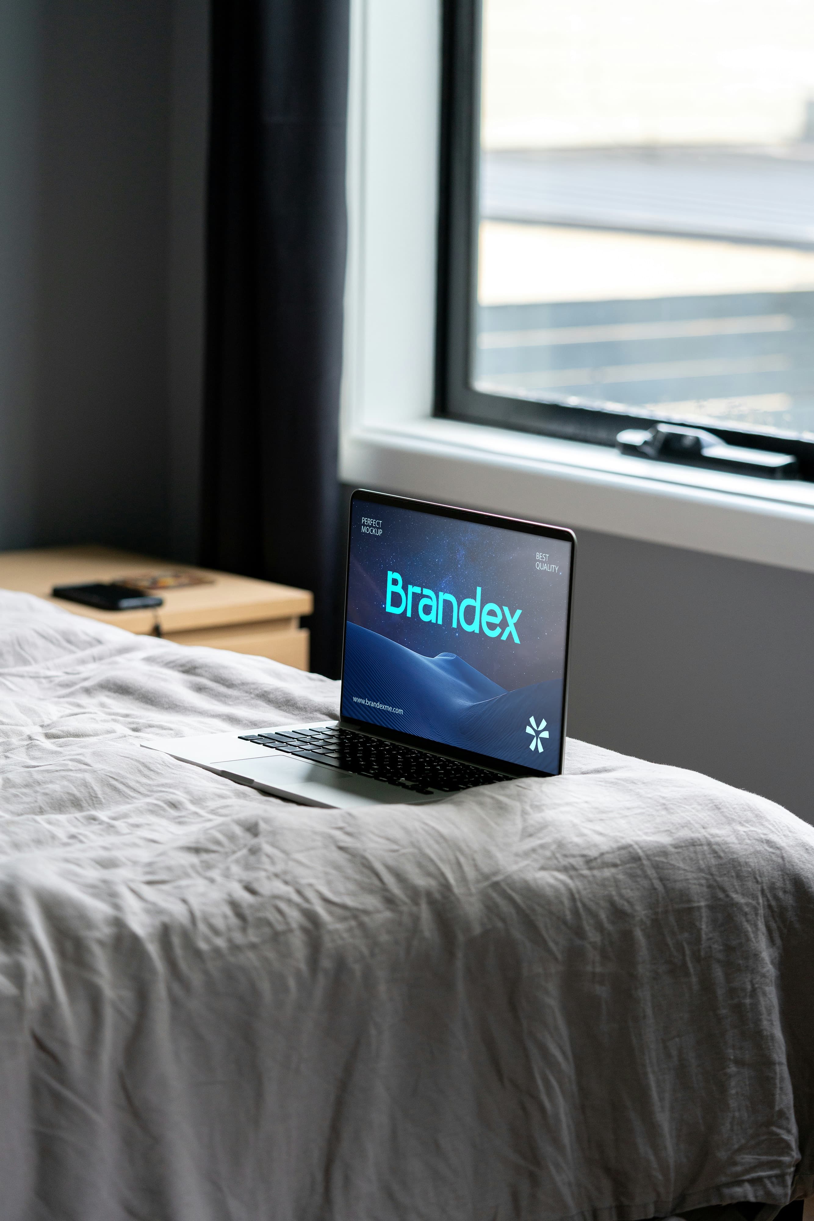 Laptop on bed mockup
