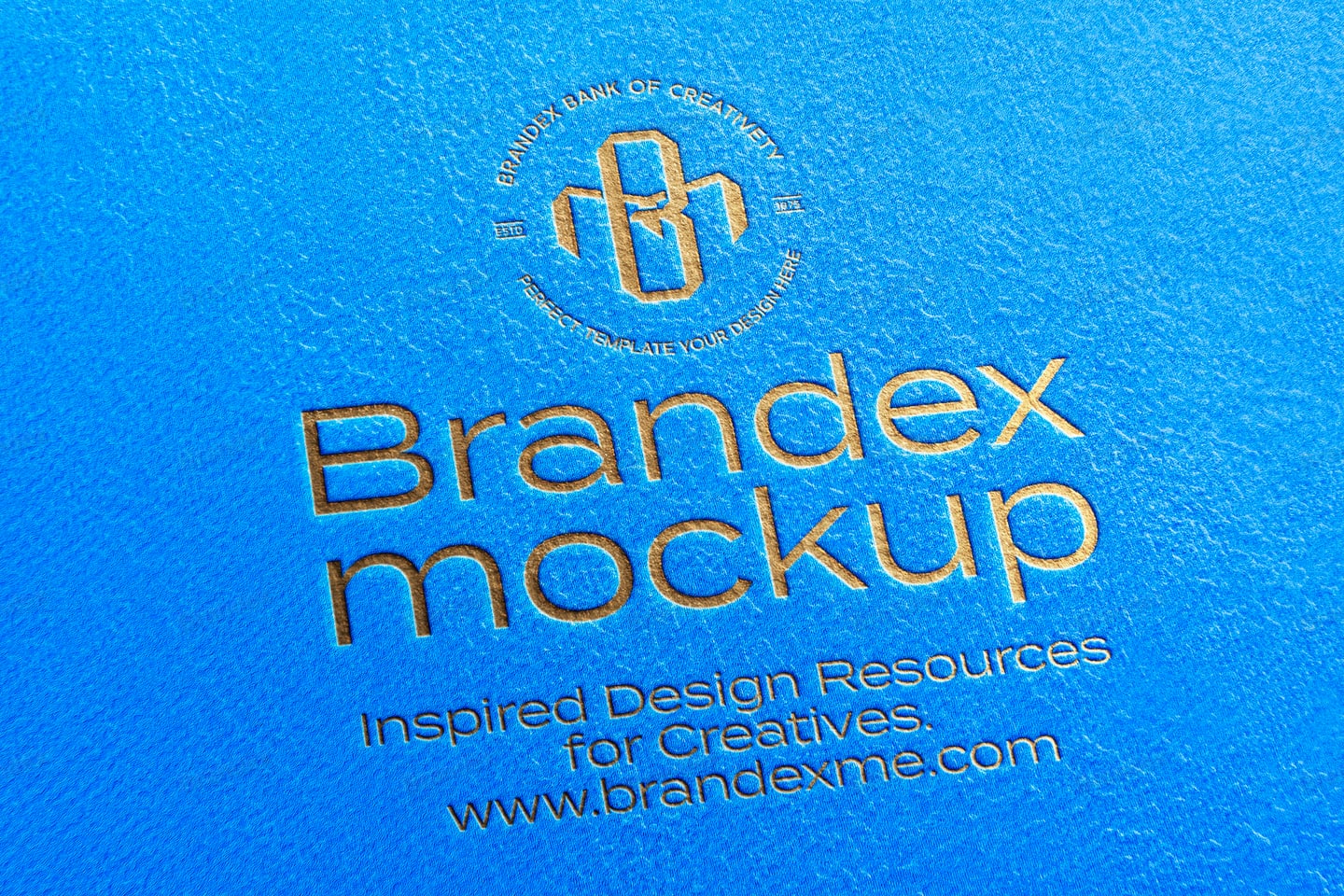 Embossed Gold Logo Mockup on Blue Textured Paper